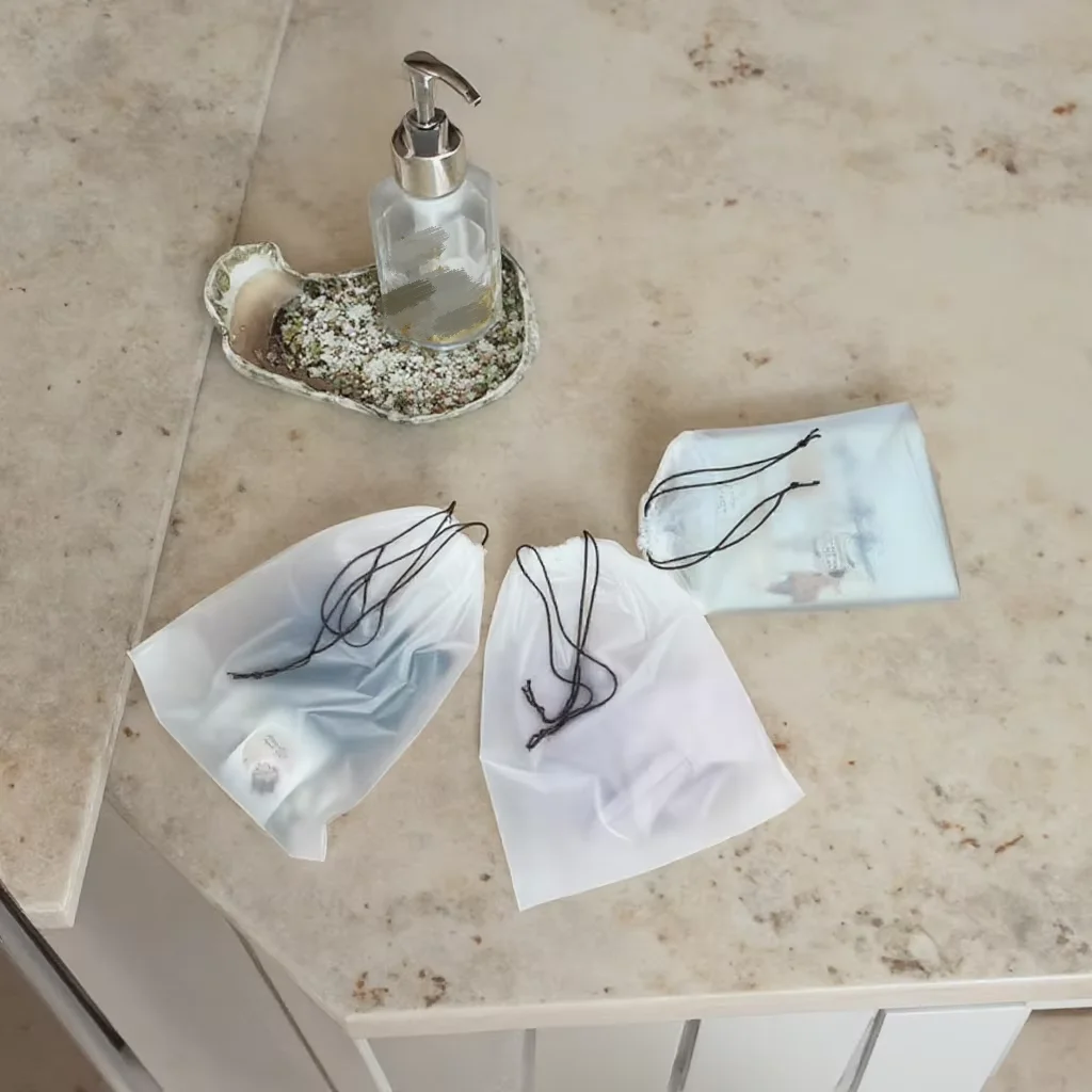 Factory customizes clear matte travel drawstring storage bags for facial cleansing wipes and cotton pads packaging