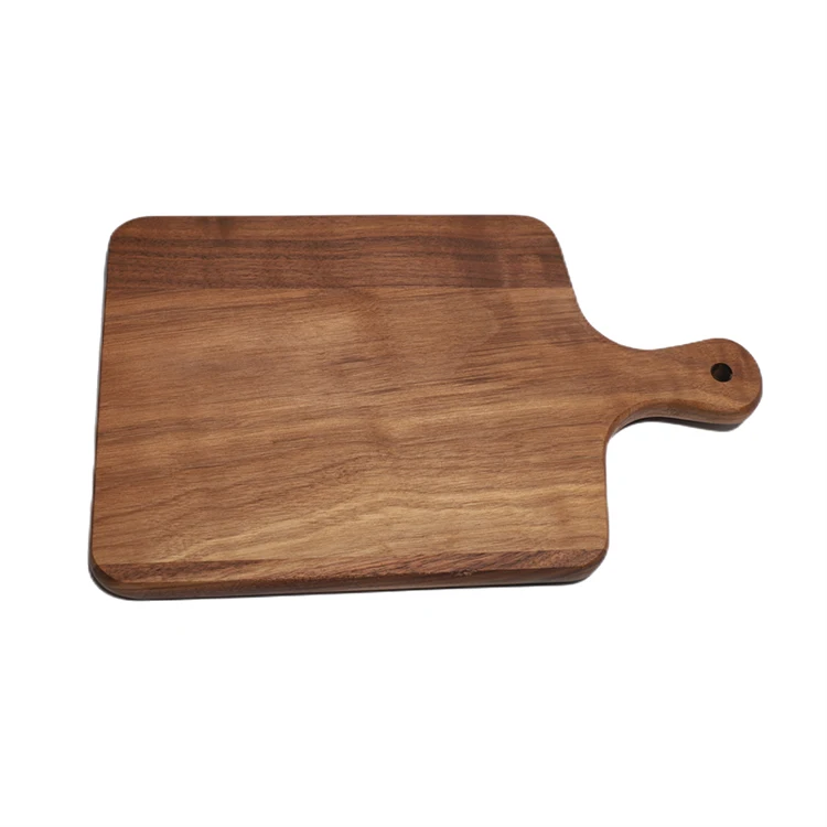 Wooden pizza peel with handles Cutting board for baking bread and cheese in the kitchen