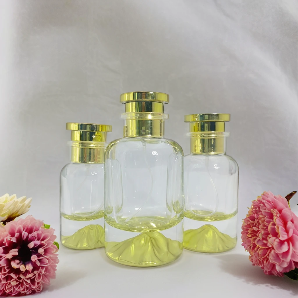 Hot selling transparent perfume glass bottle 30ml 50ml 100ml gold yellow perfume spray bottle