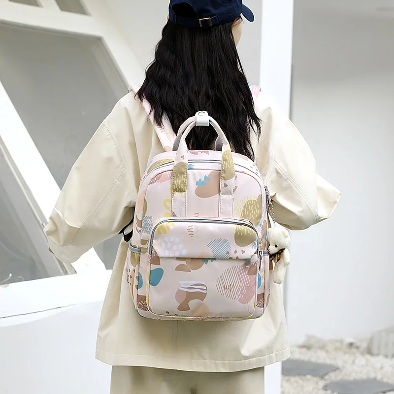 Wholesale New Design Colorful Printed Waterproof Large Capacity Washable Cloth Unisex Mom Baby Diaper Bags  Backpack