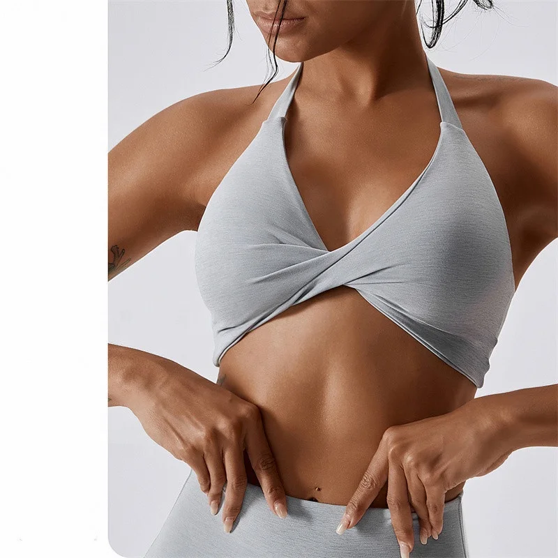 OEM Sportswear Custom Logo New Arrival Women Padded Nude Yoga Hanging Neck Twisted  Bra Fitness Sexy Blank Sports Bra For Women