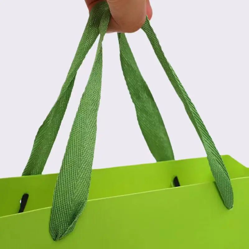 
New shiny twill polyester imitation nylon webbing perforated tea packaging gift box black head handbag rope wholesale 