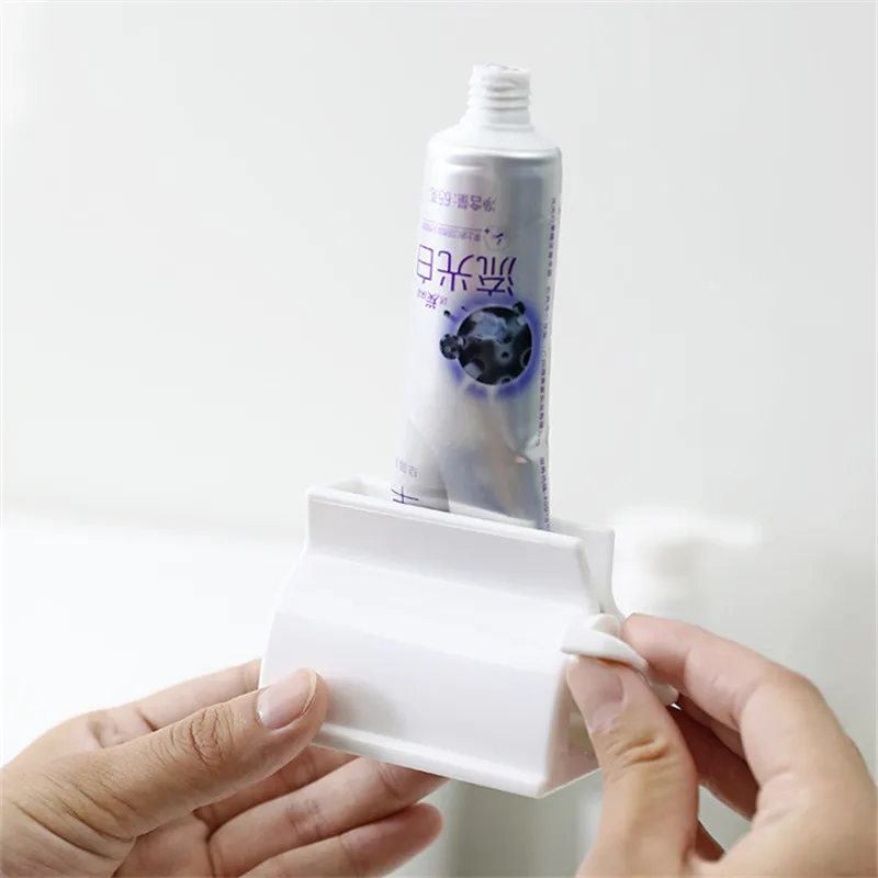 Cheap Toothpaste Seat Holder Stand Rotate Bathroom Automatic Squeezer Toothpaste Dispenser Manual Squeezer