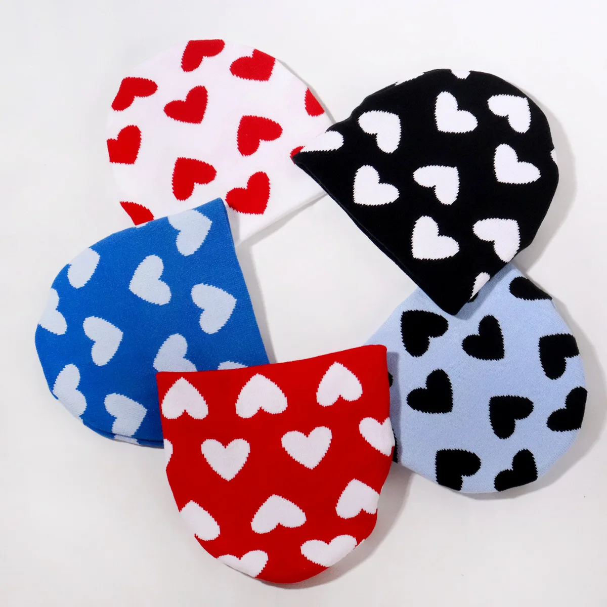 Wholesale custom winter hats jacquard skull all over heart logos cuffed beanie