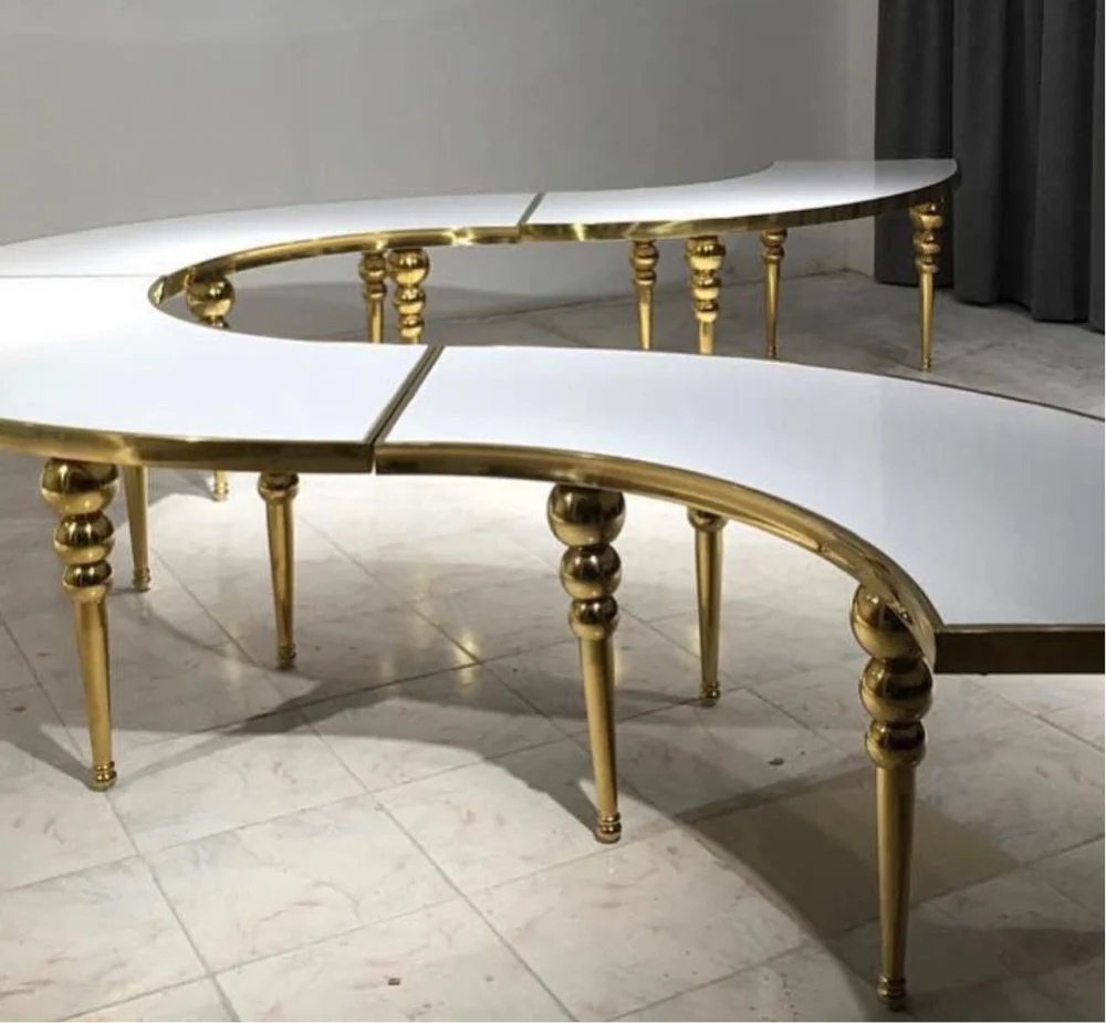 luxurious S-shaped glass top table with gold legs is perfect for elegant and stylish wedding events