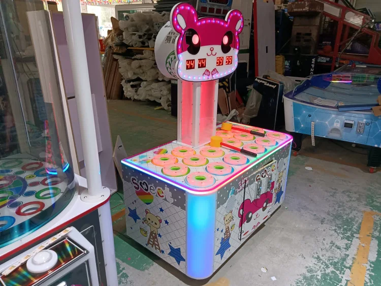 Two-person whack-a-mole coin-operated game machine