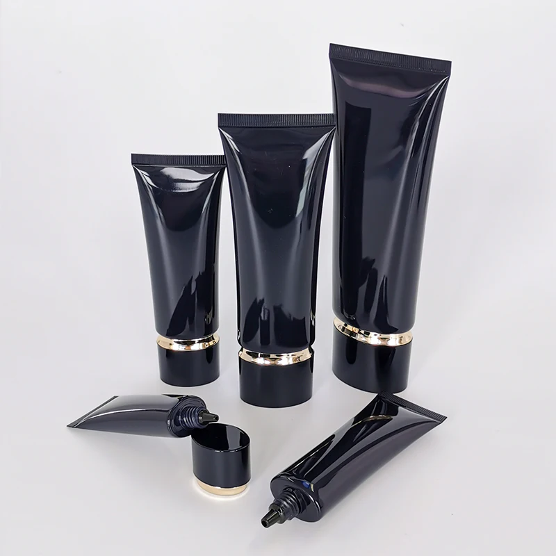 Competitive price round packaging cosmetic tube black plastic tubes withe lids