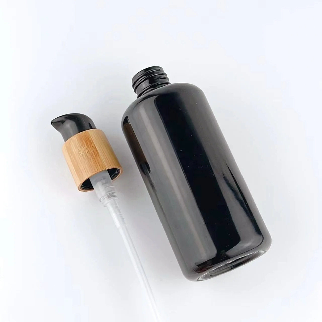 200ml glass bottles with bamboo pump empty cosmetic packaging black glass bottle body milk bottle with lotion pump