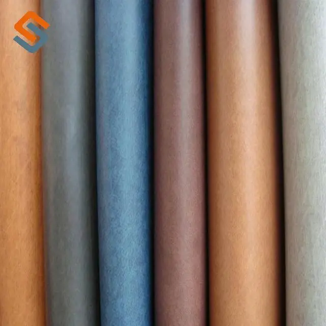 Hot Engraved Embossed Technology Pressure Change PU Leather for Jeans Label