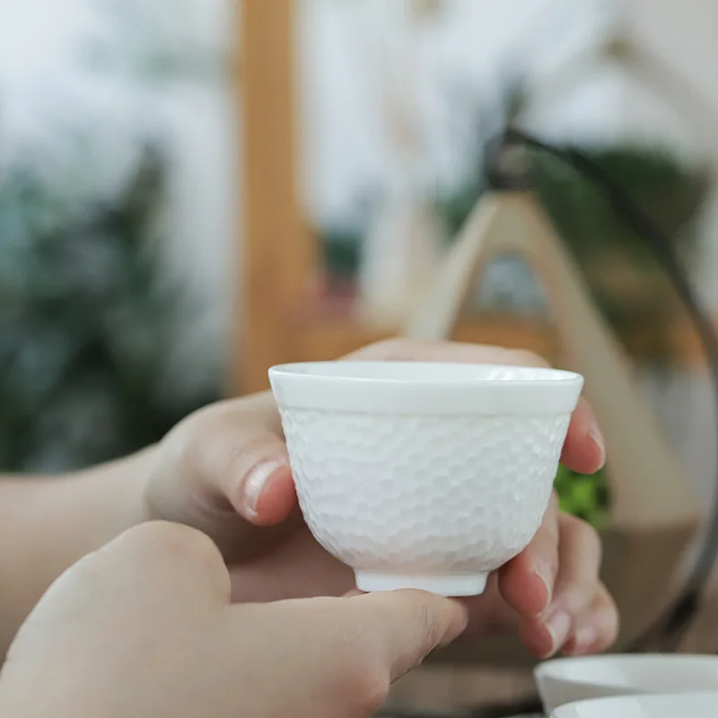  Wholesale Eco-friendly Stocked Chinese Glazed Porcelain Small Cup Relief Bone china White Ceramic