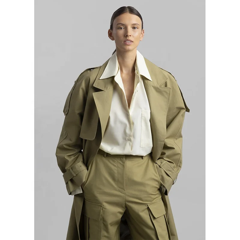 Khaki cotton trench Oversized silhouette Storm flaps Adjustable belted cuffs High vented back Front pockets trench coats women