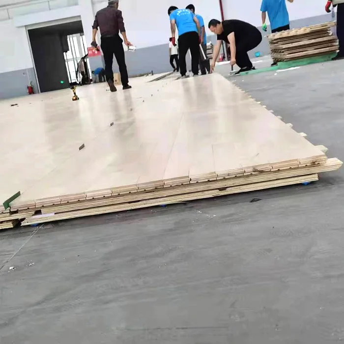 Manufacturer carefully manufactures portable solid wood sports floor basketball squash court maple oak birch beech gym