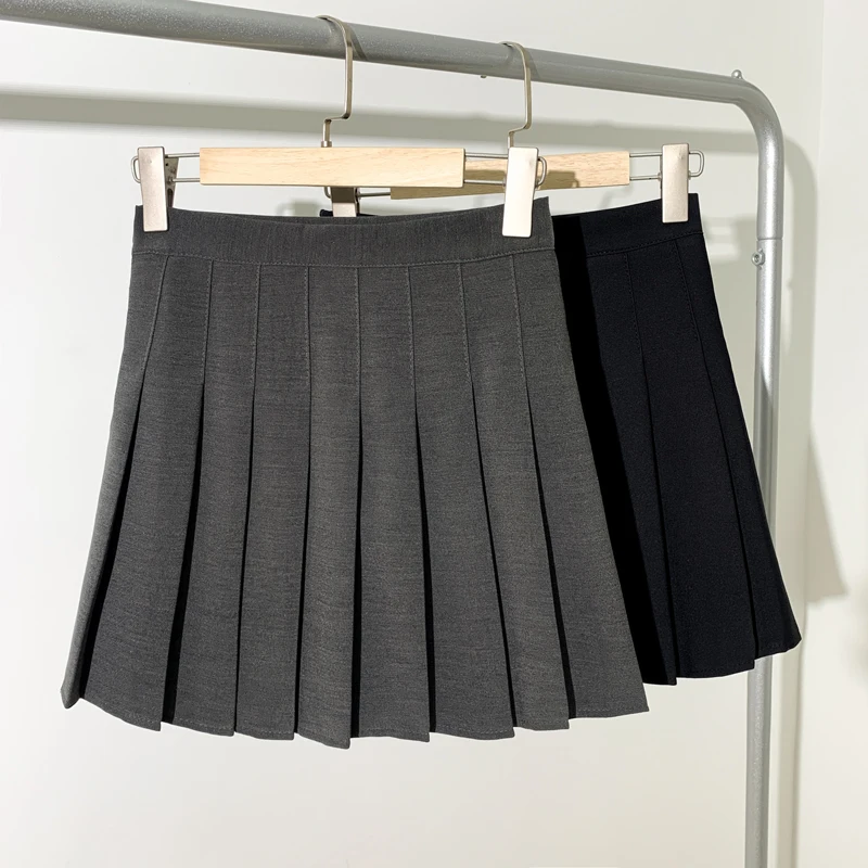 girls in mini Pleated skirt short skirt female new summer anti-glare college wind high cashew solid black a-line skirt