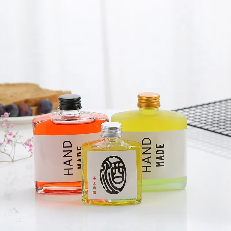 Custom 50Ml 100Ml 180Ml 250Ml Liquid Glass Mini Flat Flask Alcohol Beverage Wine Juice Whiskey Glass Bottles With Lids
