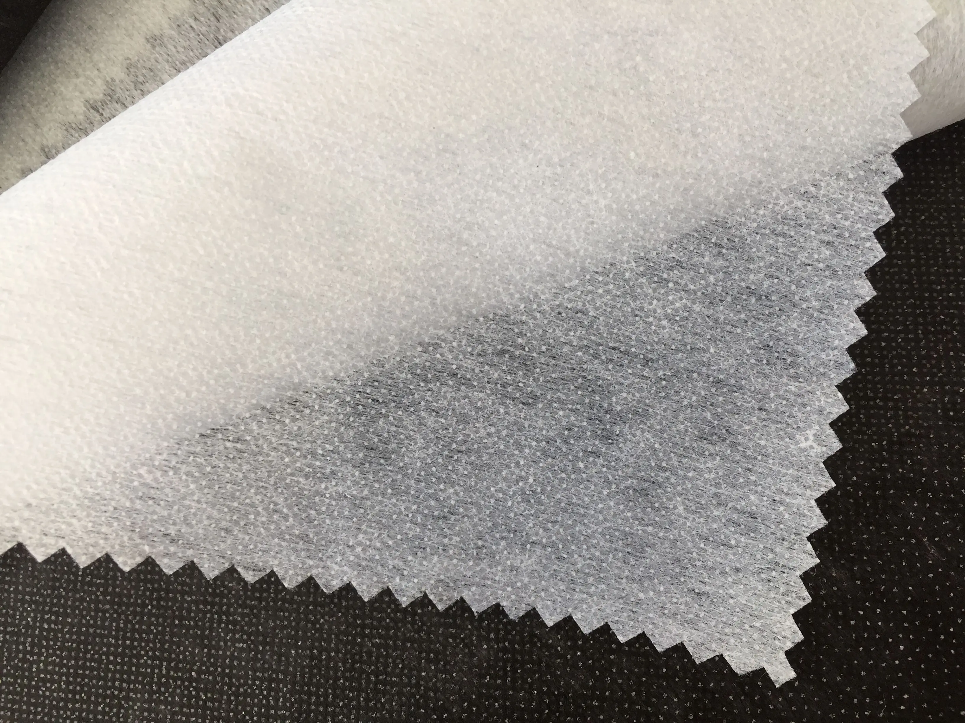 
100 Polyester reinforced stitch bond Interlining fusing brushed nonwoven buckram fabric 