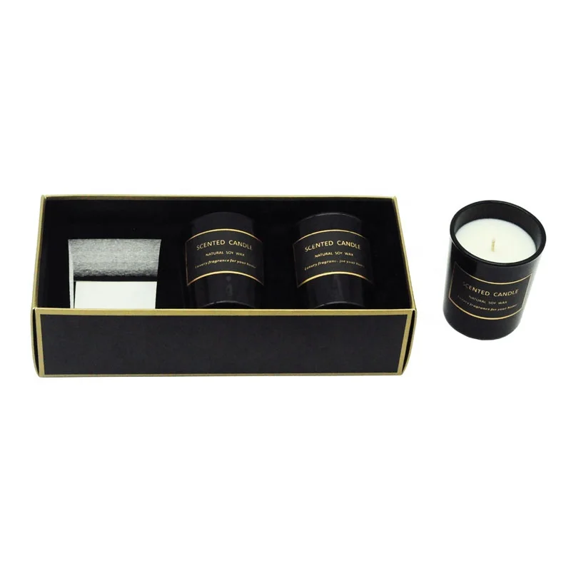 A three-piece black glass jar scented candle gift set