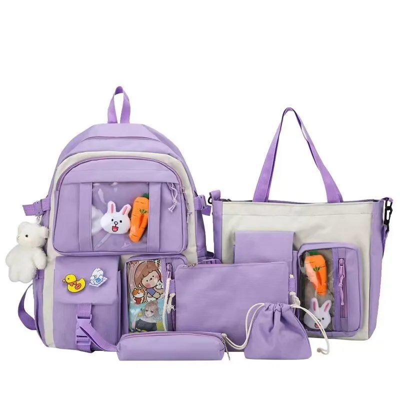 Cute elementary school students in summer, girls from grades three to five or six, large capacity backpacks, backpacks