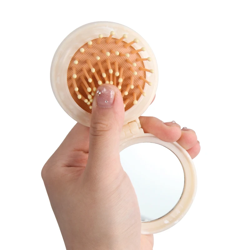 Detangling mini makeup Travel Hair brush folding pocket pop-up marble hair brush with mirror Insoluble masterbatch marbling