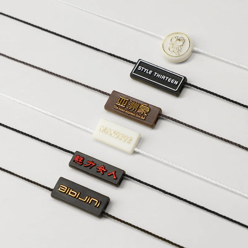 
Пользовательский рельефный фирменный логотип, пластиковый уплотнитель, вешалка для одежды 