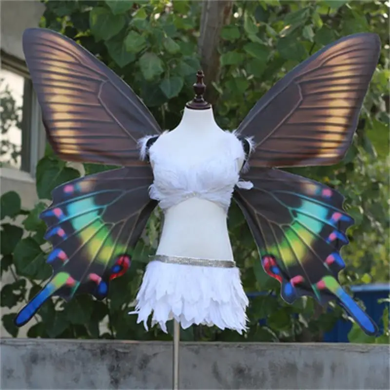 Adult models show large black wings fairy props to perform butterfly wings