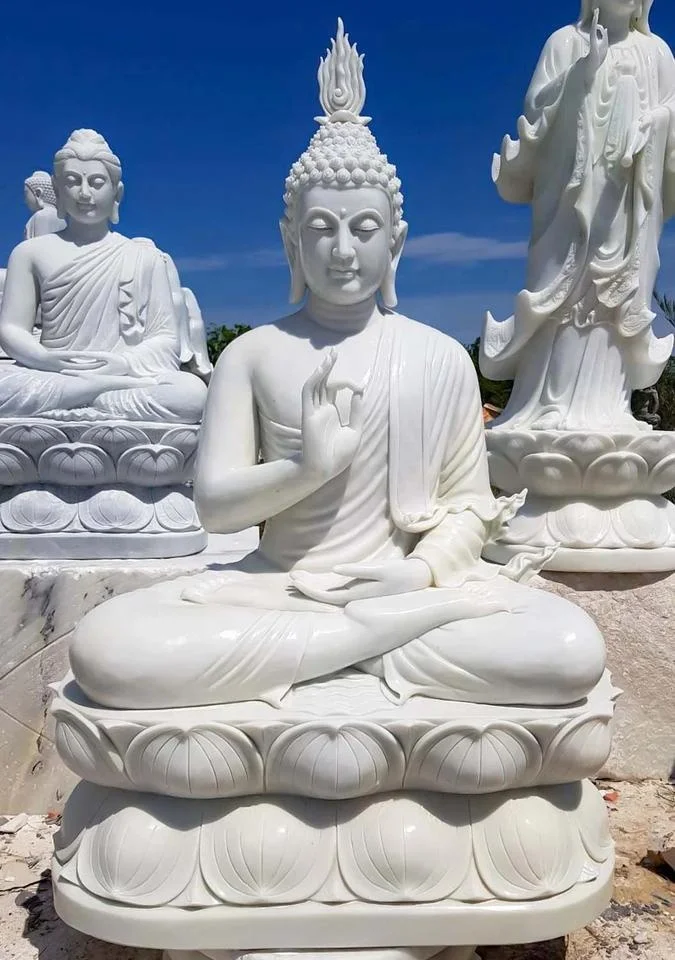 white natural marble buddha sitting on lotus statues