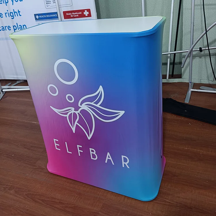 Low MOQ Exhibition Booth Portable Tension Fabric Advertising Display Auto Shrink Pop Up Display Counter Table
