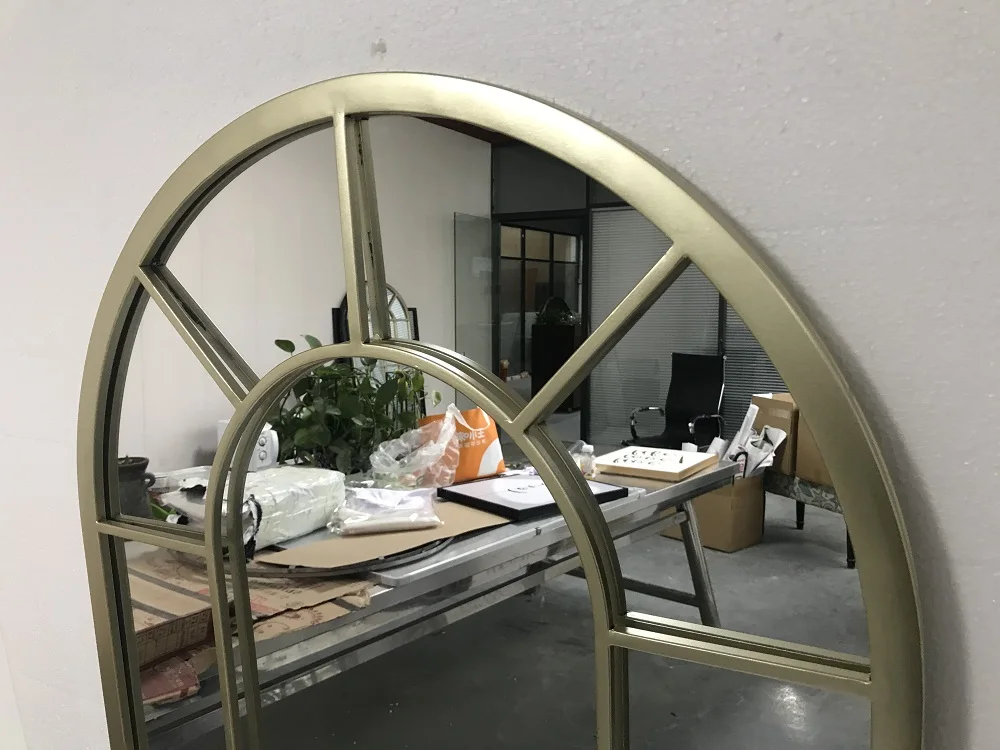 large arched full-length metal floor standing dressing mirror