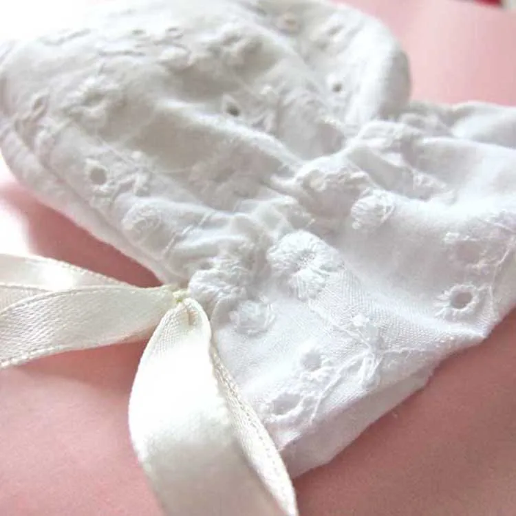 white cotton eyelet lace gift bag with ribbon