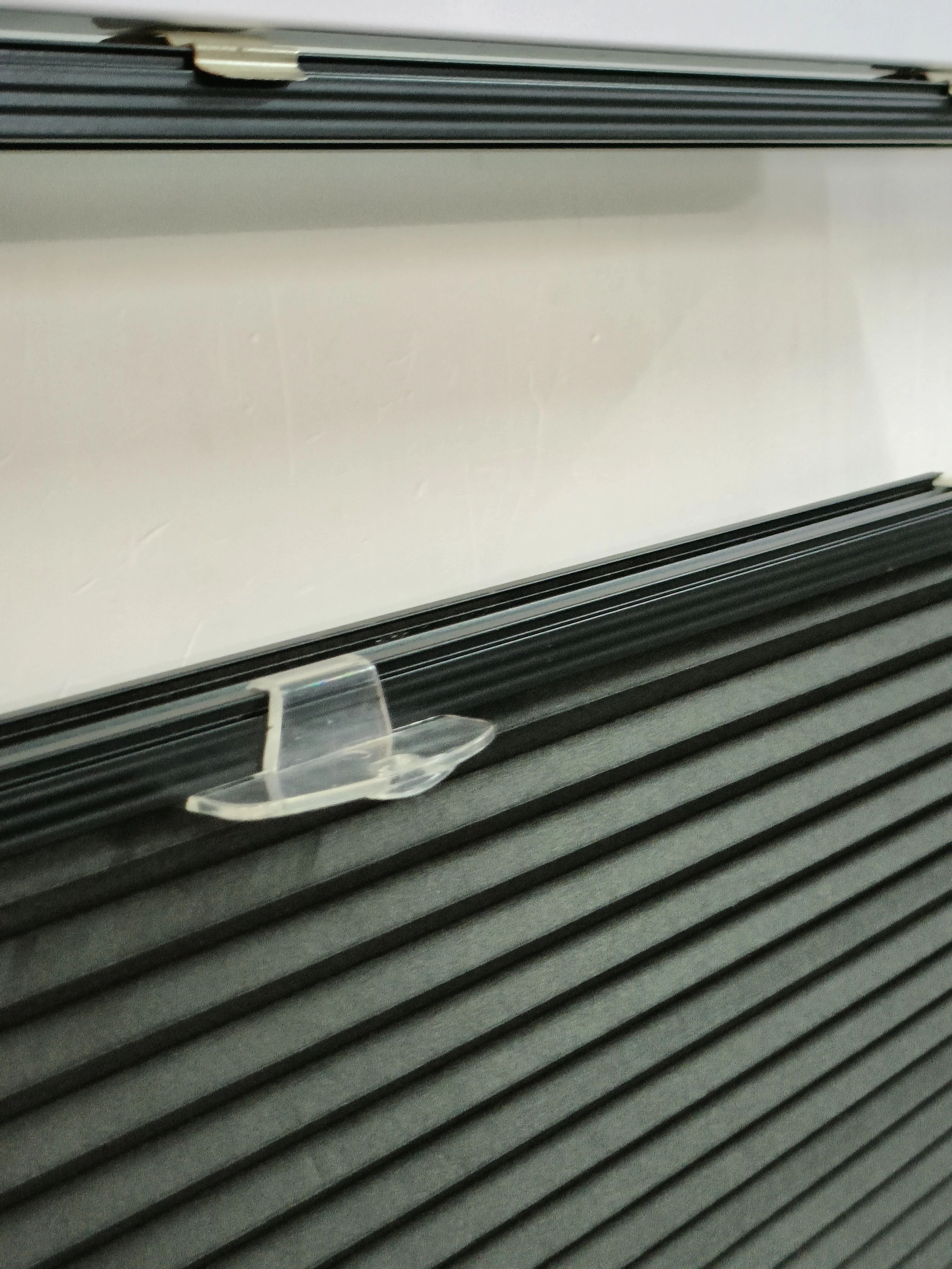 Cordless black color blackout cellular blind