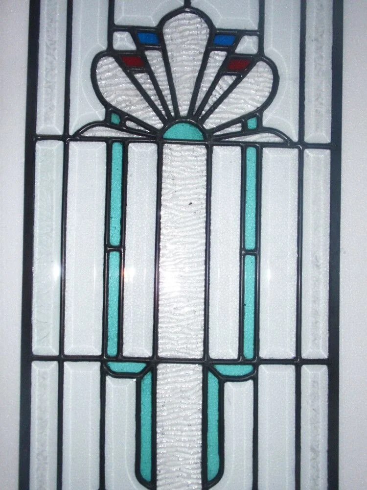 beveled glass window in oak frame with brass capped lead came
