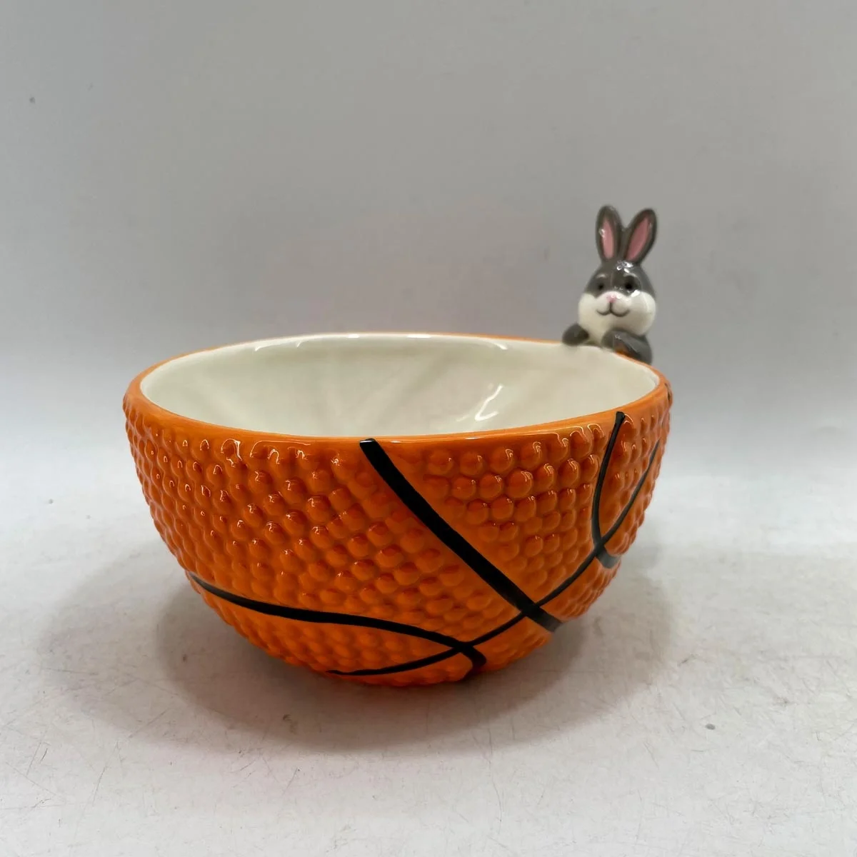 Hand painted ceramic football shaped candy bowl with dog handle