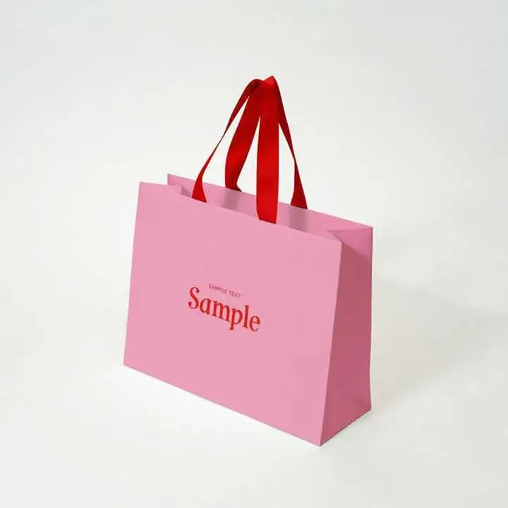 Luxury clothing retail gift paper bag shopping packaging paper bag with handle