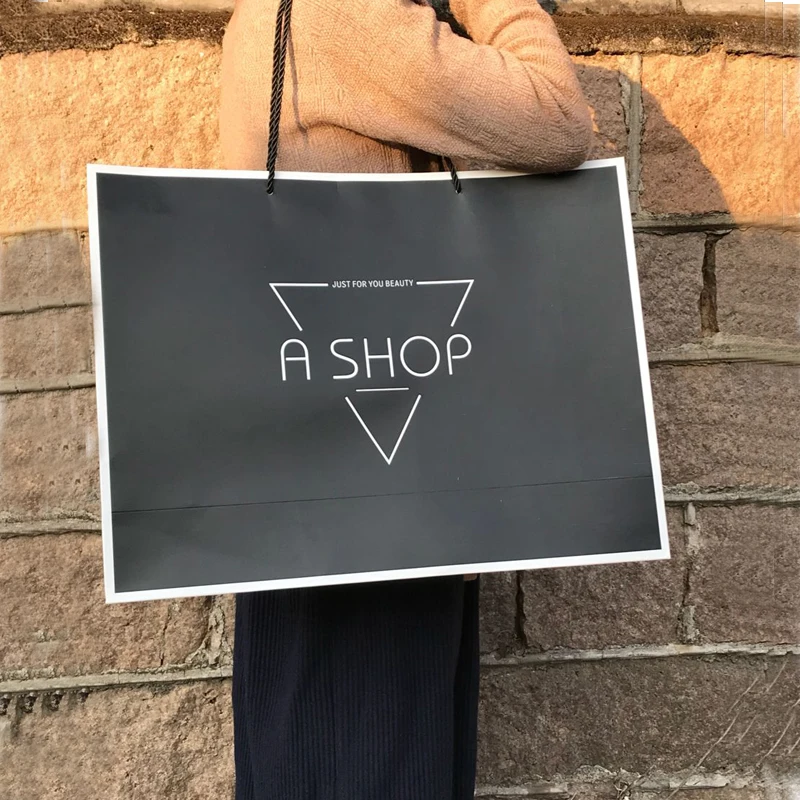 Hot Sale Customized logo Clothing paper bag with handle Luxury Custom paper gift bags with logo printing