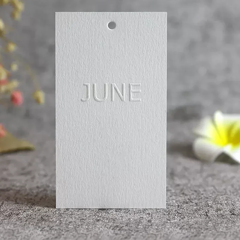 Customized 600g texture cotton paper luxury  labels logo embossed hang tags for cloths