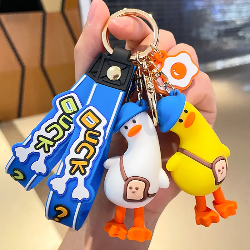 Funny tilt head duck cute anime pvc 3d keychain custom logo pvc rubber keychain Key Handbag Accessories