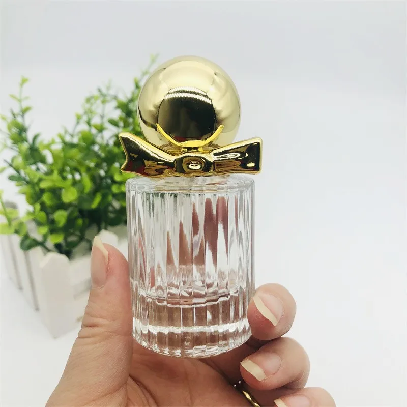 Роскошные прозрачные пустые многоразовые стеклянные флаконы для духов с золотой крышкой и бантом 30 мл 50
