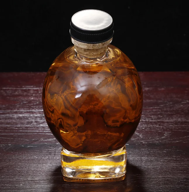 Factory direct sales skull shape clear glass Unique design 750ml glass whiskey vodka decanter glass bottle with caps