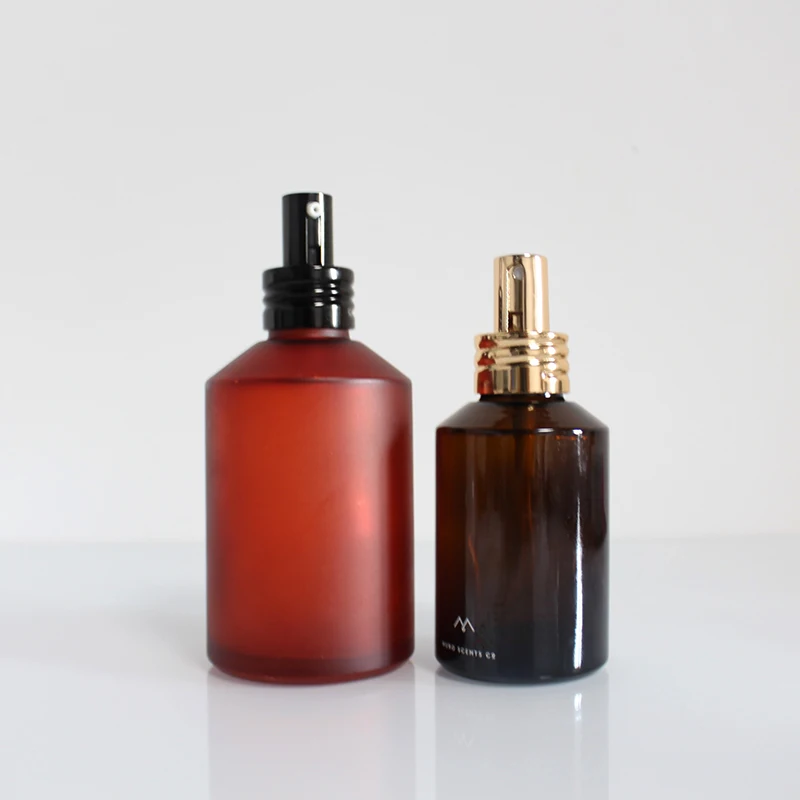 Empty 2 oz and 4 ounce 100ml 120ml matte clear amber glass spray bottle with shinny golden Fine Mist Sprayer