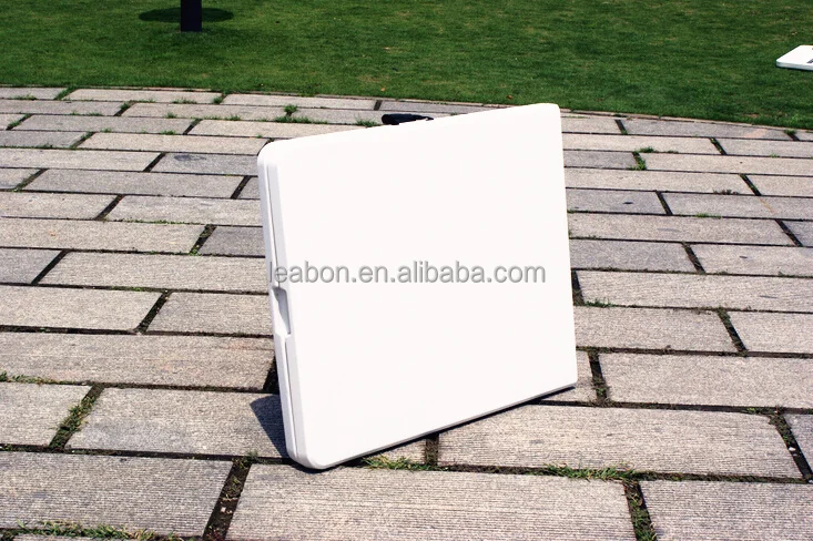 Rectangular portable folding plastic table for indoor and outdoor uses