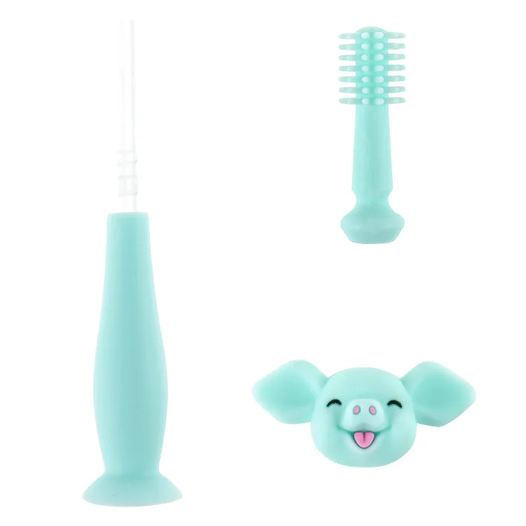 Factory With suction cup grip can be customized baby toothbrush cartoon piggy shape silicone toothbrush baby