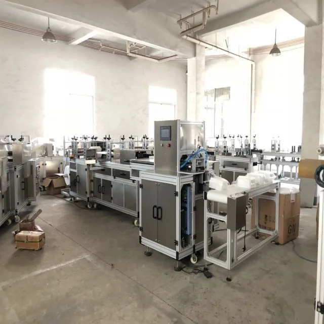Fully automatic bouffant cap making machine with packing