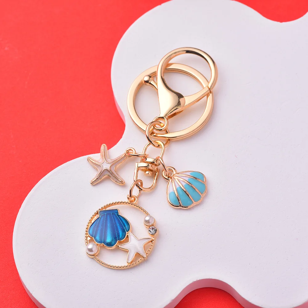 Xinxing Ocean Wind Imitation Pearl Shell Starfish Keychain Alloy Material Drop Glaze Craft Women Bag Pendant Colour Key Chain