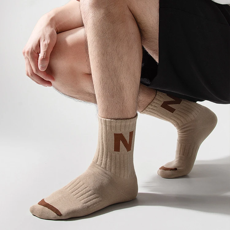 Autumn winter combed cotton jacquard embroidery sports socks custom logo women men crew socks