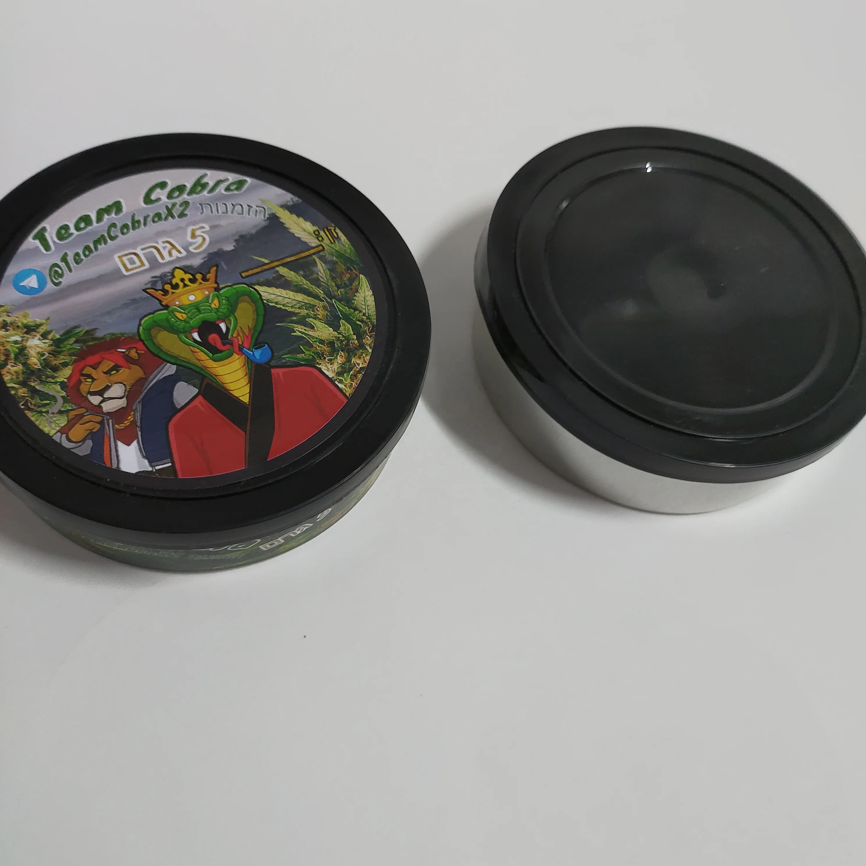 
3.5gram pressitin tin wholesale with clear or black plastic top and custom stickers 