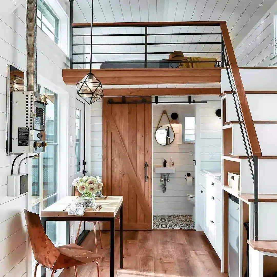 Winterized tiny cabin house with steel structure on wheels