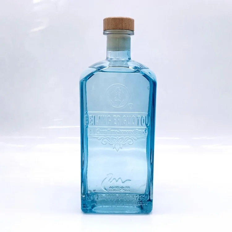 Manufacturer Sale Blue Embossed Logo 750ml Liquor Vodka Spirit Gin Glass Bottles With Wide Neck Whiskey