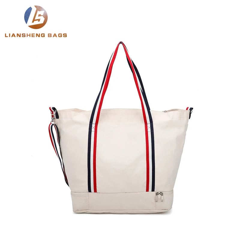 
Large canvas bag with separate layer of shoes and umbrellas underneath 