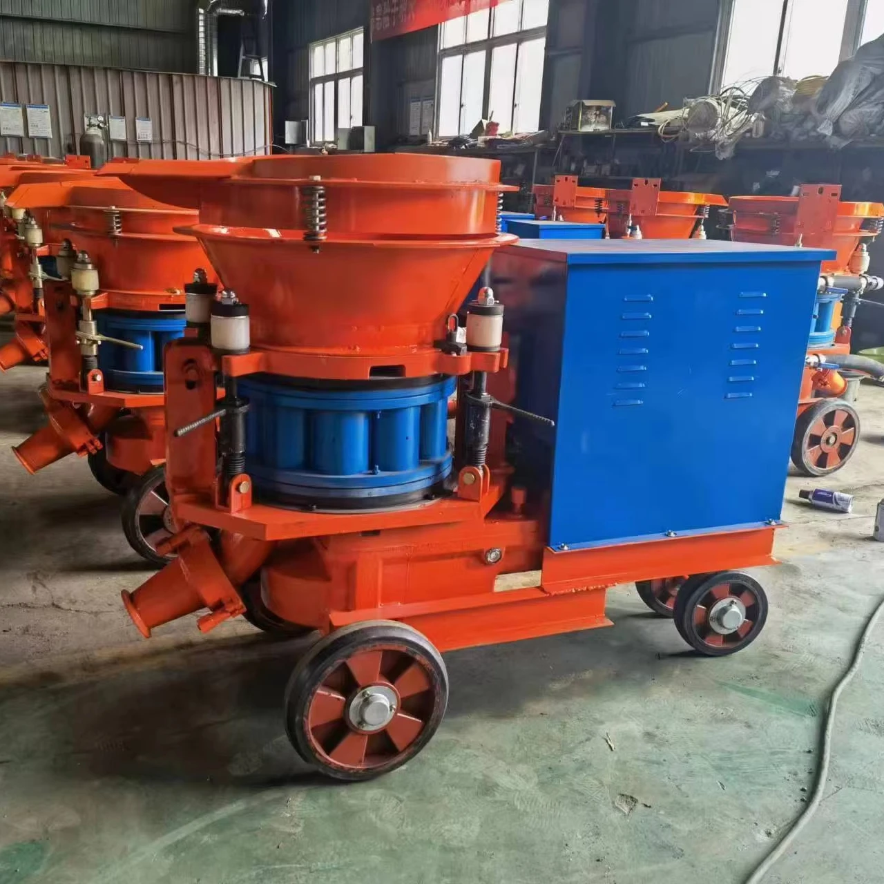 dry shotcrete machine is developed for the application of shotcrete in tunnel building mines and slopes