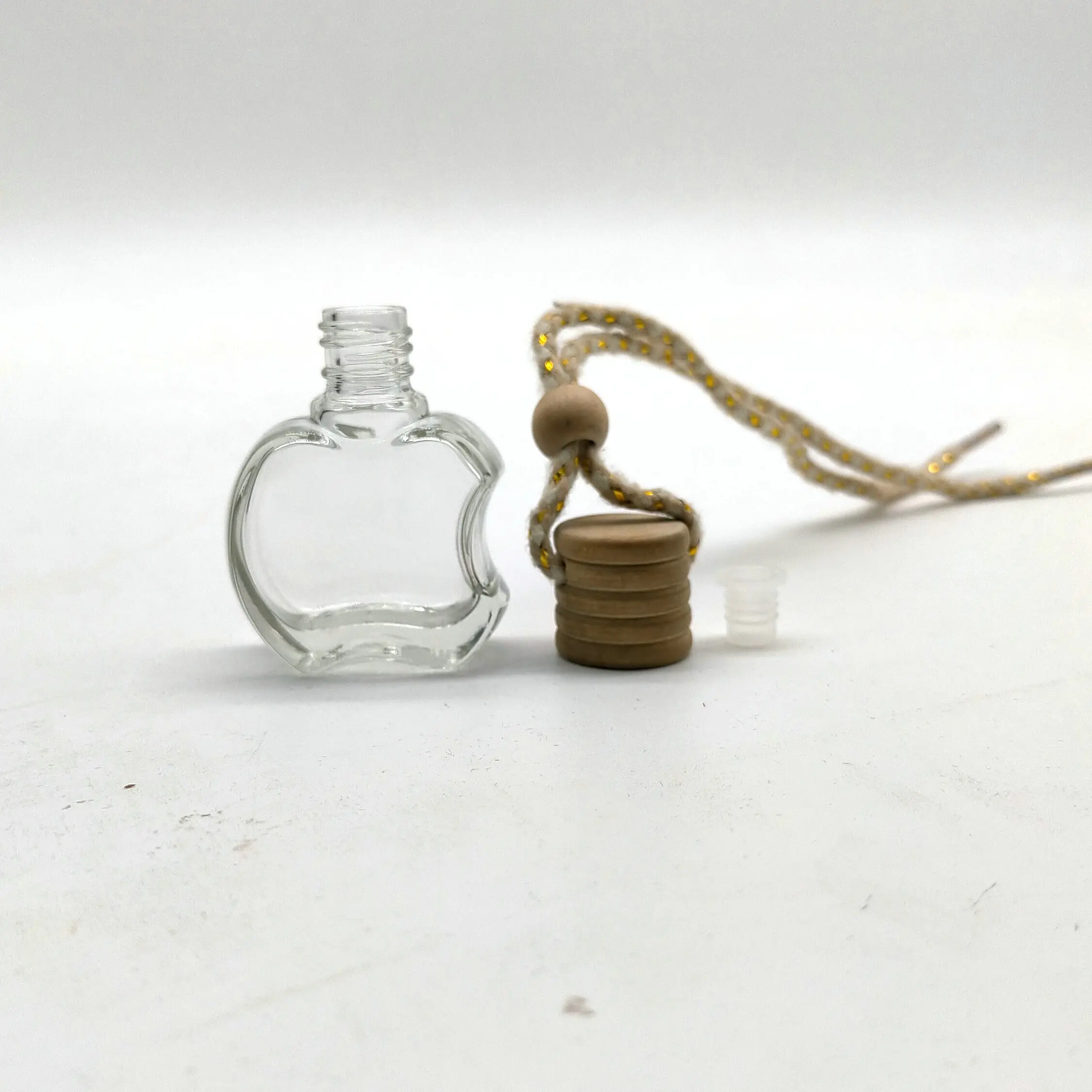 Factory sale 10ml apple car perfume bottles  factory custom and open the mold prdouce kinds of car perfume glass bottle