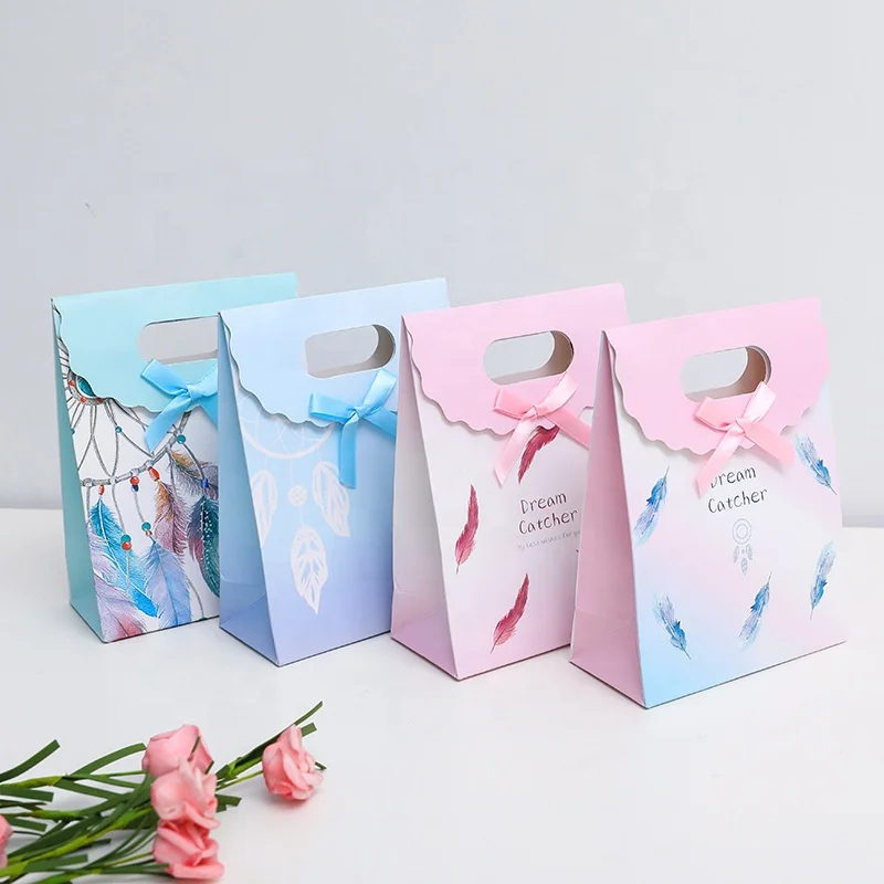 
New feather pattern clamshell high-end fashion clothing shopping tote bag gift white card paper bag customization spot 